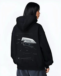Black hoodie worn by a female model, back view, featuring BMW 750I rs turbo motorsport euro german street graphic.