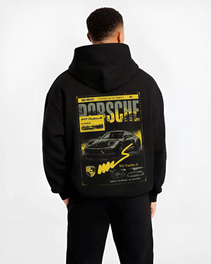 Black hoodie worn by a male model, back view, featuring Porsche 911 Turbo S rs 911 turbo racing german street classic graphic.