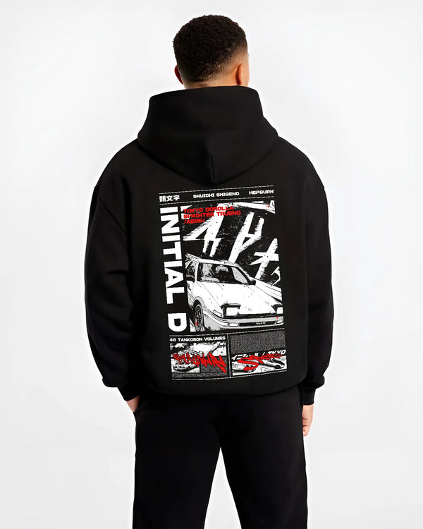 Black hoodie worn by a male model, back view, featuring Toyota AE86 racing drift jdm tuner initial d street graphic.