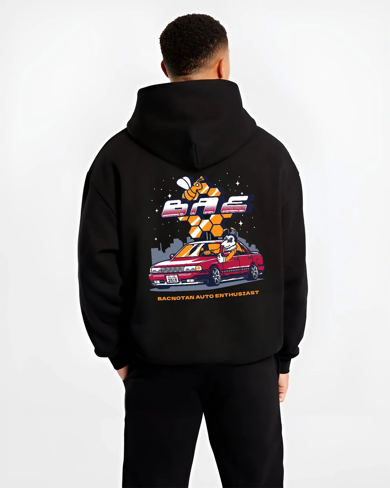 Black hoodie worn by a male model, back view, featuring street retro enthusiast racing performance motorsport automotive graphic.