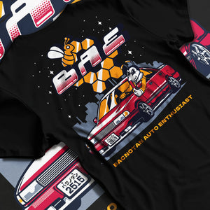 Black T-shirt laid flat with natural fabric folds, featuring street retro enthusiast racing performance motorsport graphic.