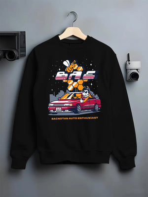 Black crewneck sweatshirt on a hanger against a grey wall, featuring street retro enthusiast racing performance motorsport graphic.