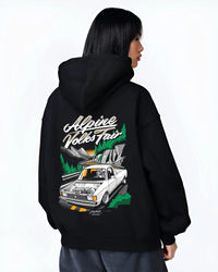 Black hoodie worn by a female model, back view, featuring Volkswagen street retro racing performance motorsport automotive graphic.