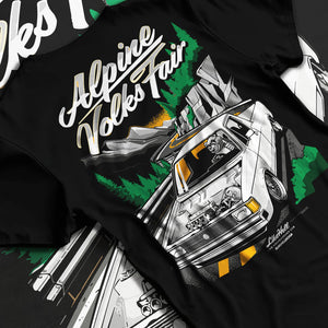 Black T-shirt laid flat with natural fabric folds, featuring Volkswagen street retro racing performance motorsport graphic.