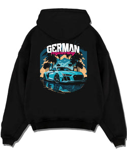 Black pullover hoodie laid flat on a white background, featuring Audi R8 german street racing performance motorsport graphic.