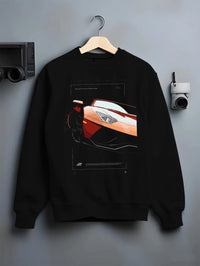 Black crewneck sweatshirt on a hanger against a grey wall, featuring Lamborghini Aventador racing street performance graphic.