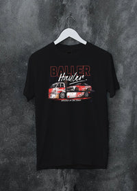 Black crewneck T-shirt on a hanger against a grey wall, featuring racing drift japanese tuner street performance motorsport graphic.