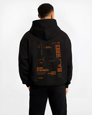Black hoodie worn by a male model, back view, featuring Mercedes-Benz AMG rs racing motorsport street performance blkamg.