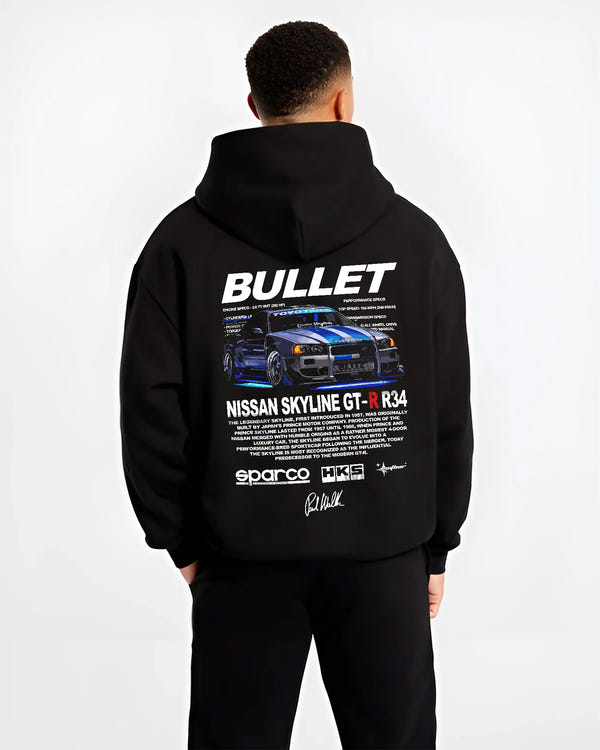Black hoodie worn by a male model, back view, featuring Nissan Skyline R34 gt r r34 skyline racing drift jdm street graphic.