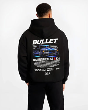 Black hoodie worn by a male model, back view, featuring Nissan Skyline R34 gt r r34 skyline racing drift jdm street graphic.