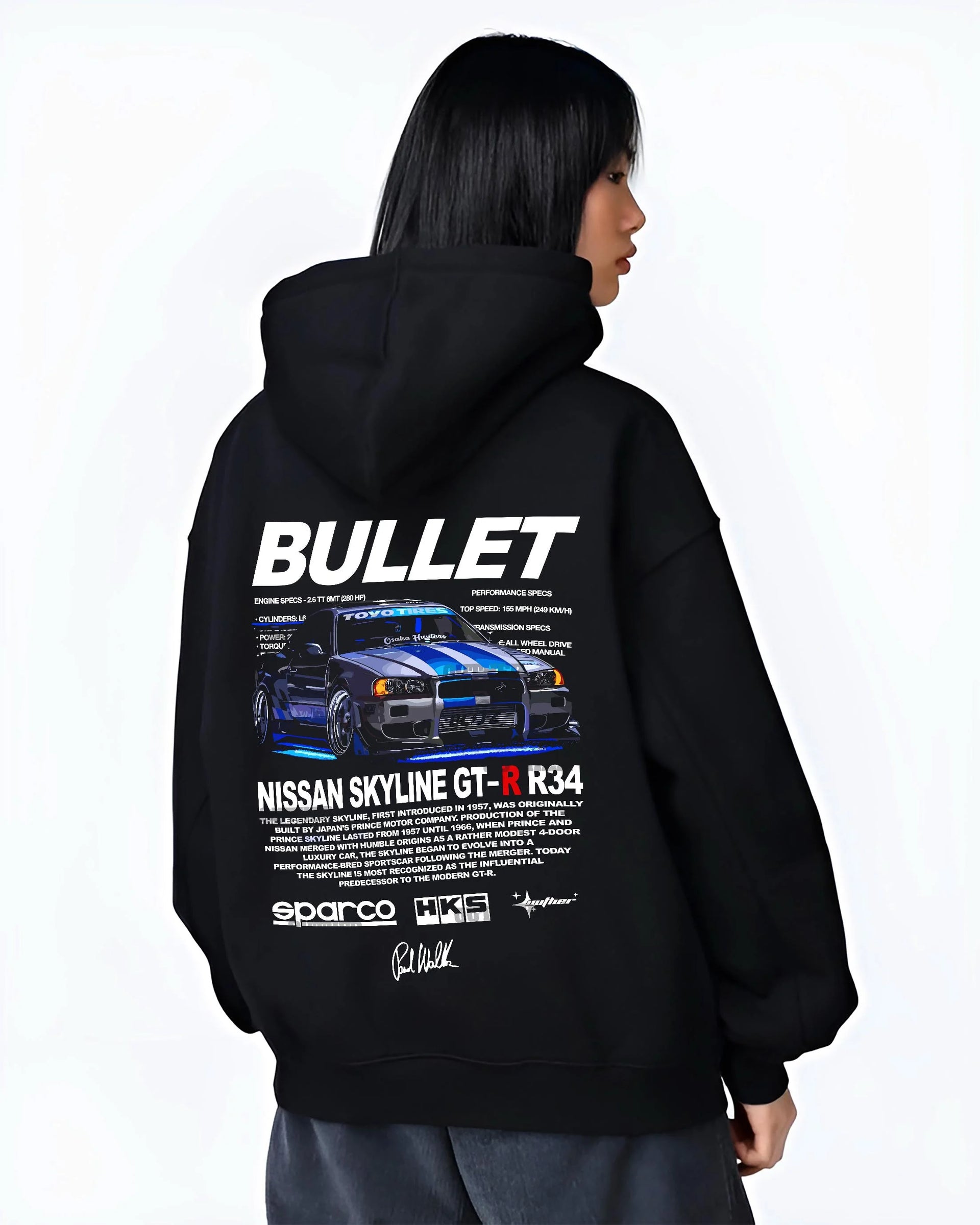 Black hoodie worn by a female model, back view, featuring Nissan Skyline R34 gt r r34 skyline racing drift jdm street graphic.
