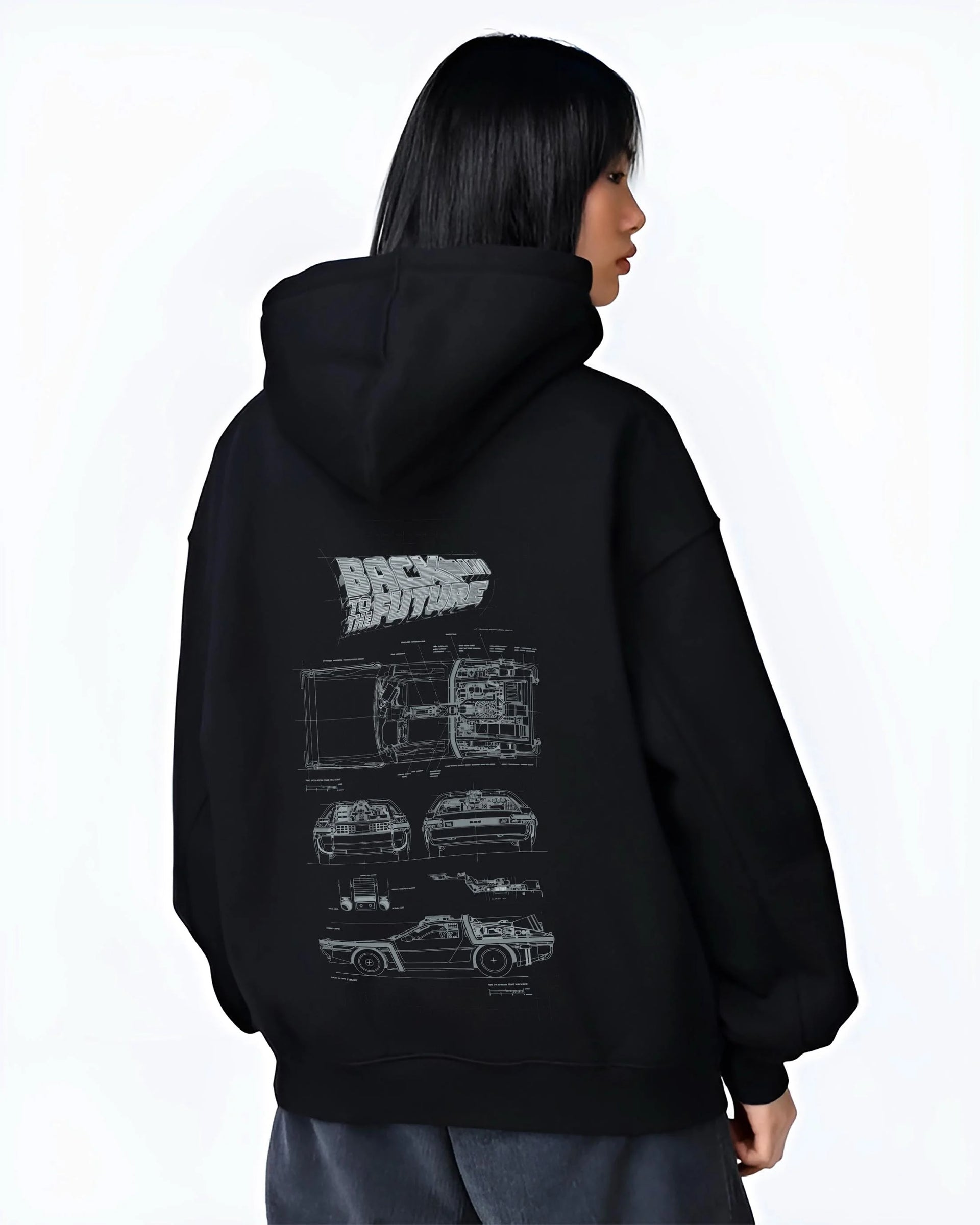 Black hoodie worn by a female model, back view, featuring DeLorean DMC-12 street retro racing performance motorsport graphic.