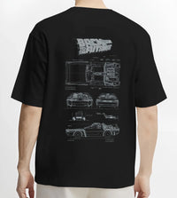Black T-shirt worn by a male model, back view, featuring DeLorean DMC-12 street retro racing performance motorsport graphic.