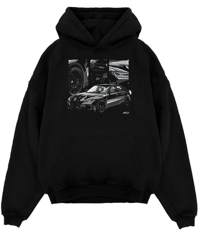 Black pullover hoodie laid flat on a white background, featuring BMW M3 rs motorsport german racing street performance graphic.