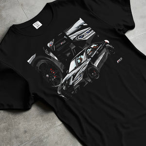 Black T-shirt laid flat with natural fabric folds, featuring BMW M3 rs motorsport german racing street performance graphic.