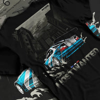 Black T-shirt laid flat with natural fabric folds, featuring BMW M3 gtr drift need for speed legend speed racing graphic.