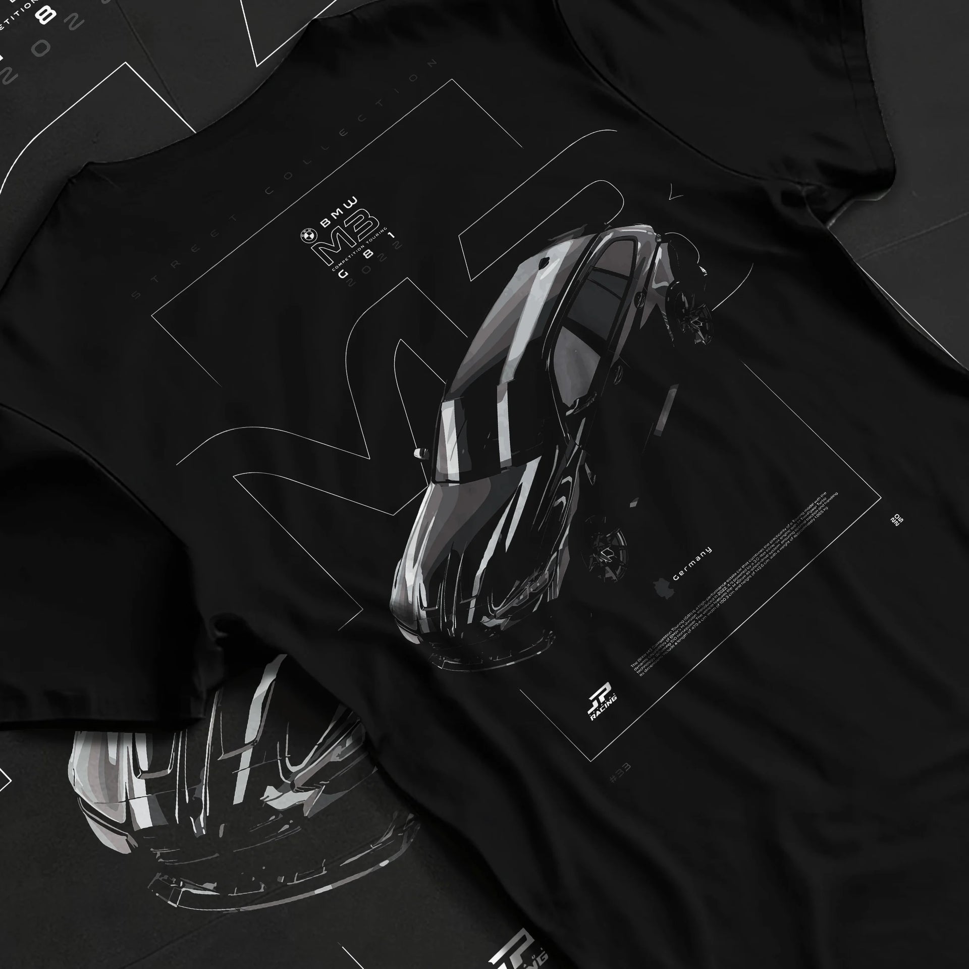 Black T-shirt laid flat with natural fabric folds, featuring BMW M3 street racing performance motorsport automotive graphic.