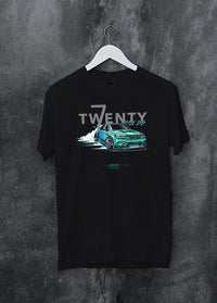Black crewneck T-shirt on a hanger against a grey wall, featuring BMW turbo drift racing street performance motorsport graphic.