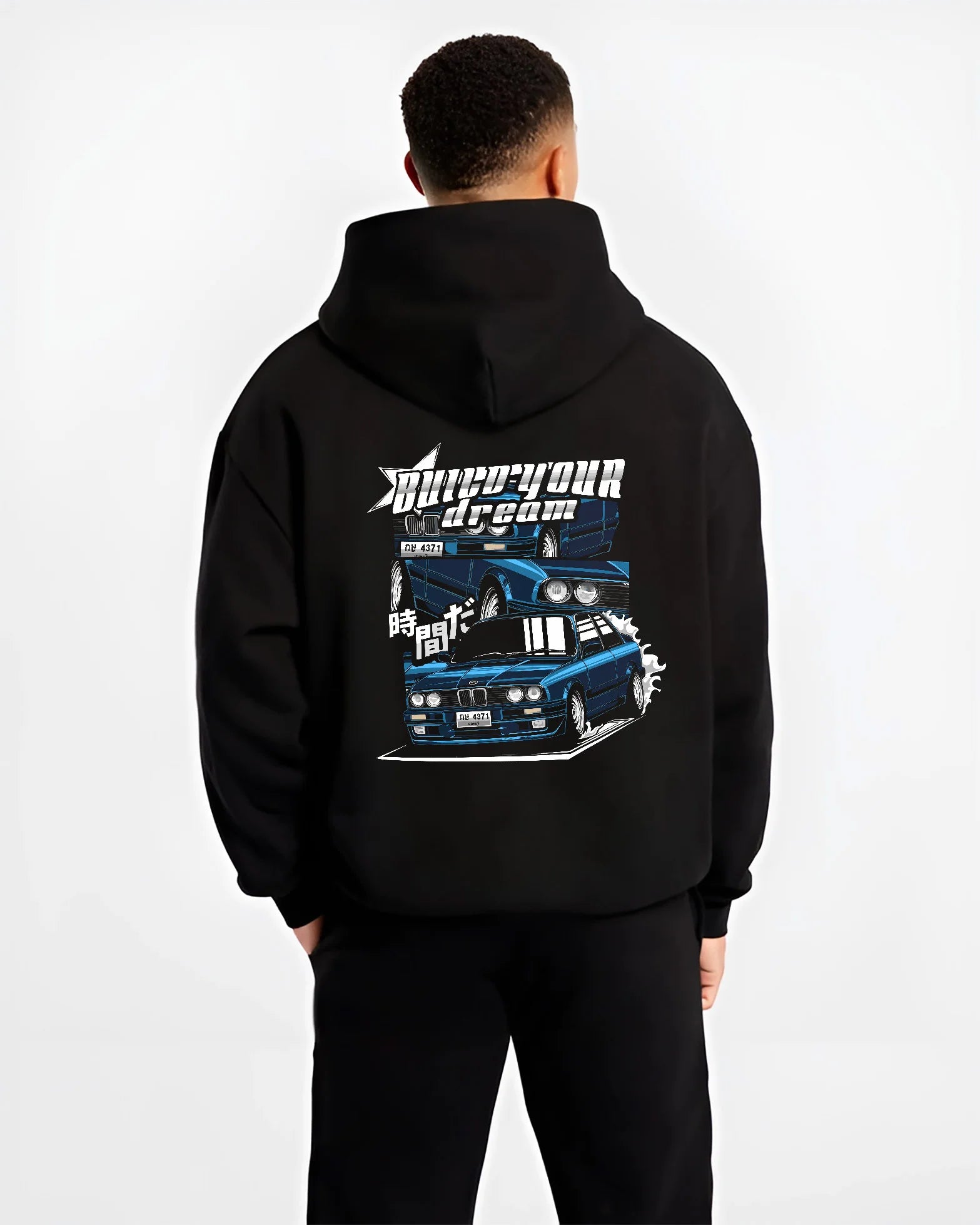 Black hoodie worn by a male model, back view, featuring BMW E30 jdm japanese retro classic enthusiast racing graphic.
