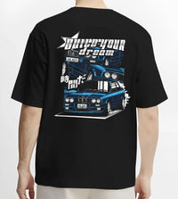 Black T-shirt worn by a male model, back view, featuring BMW E30 jdm japanese retro classic enthusiast racing graphic.