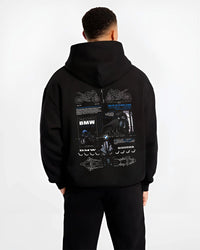 Black hoodie worn by a male model, back view, featuring BMW S1000RR racing drift german street speed performance graphic.