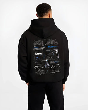 Black hoodie worn by a male model, back view, featuring BMW S1000RR racing drift german street speed performance graphic.