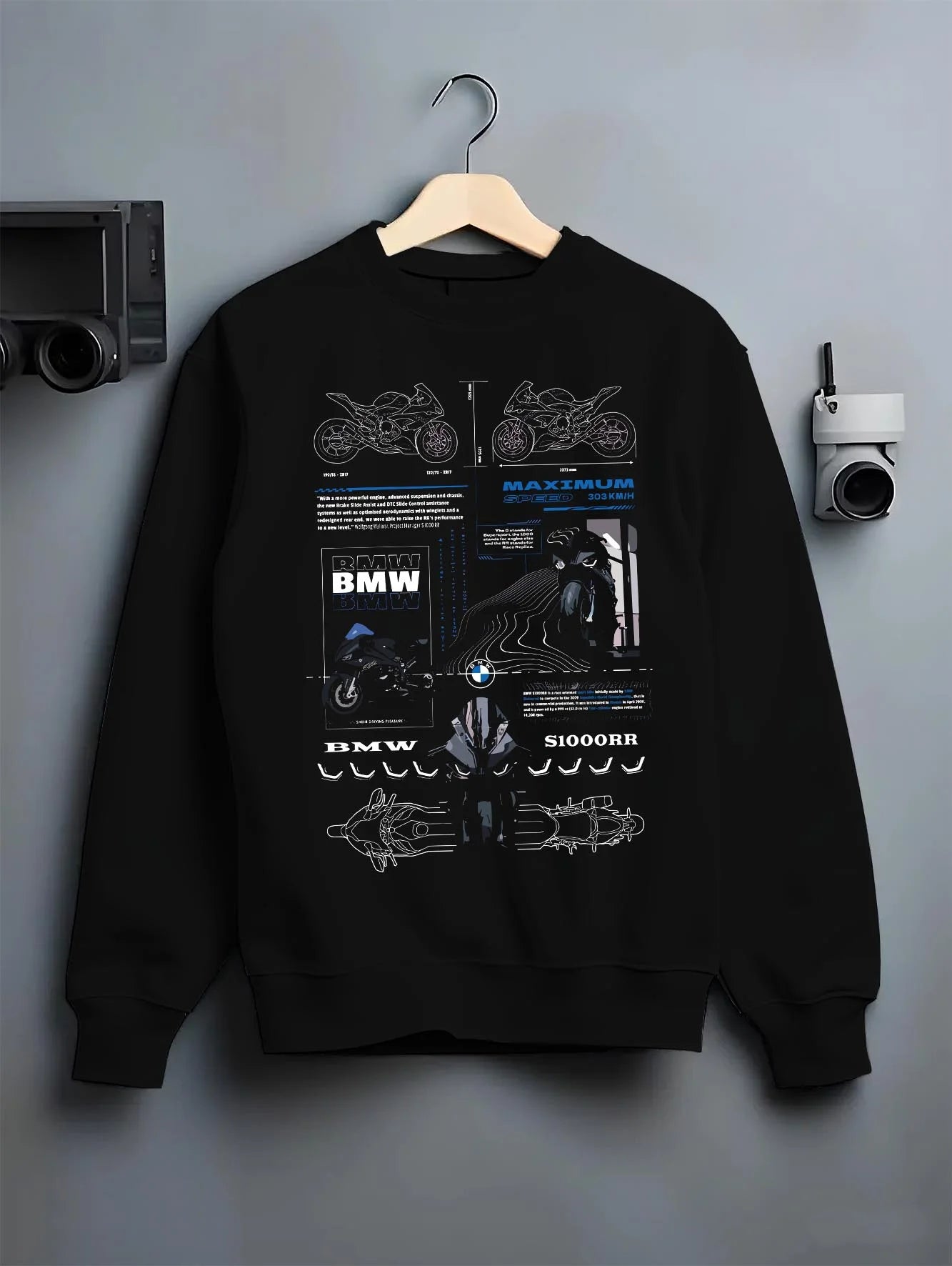 Black crewneck sweatshirt on a hanger against a grey wall, featuring BMW S1000RR racing drift german street speed graphic.