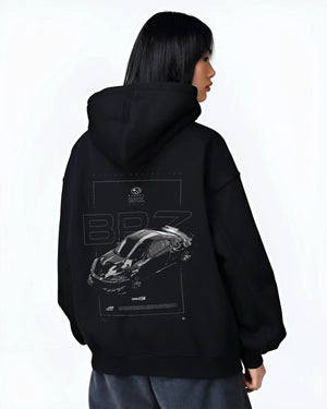 Black hoodie worn by a female model, back view, featuring Subaru BRZ rs racing drift formula motorsport jdm street graphic.