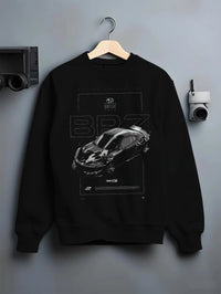 Black crewneck sweatshirt on a hanger against a grey wall, featuring Subaru BRZ rs racing drift formula motorsport jdm graphic.