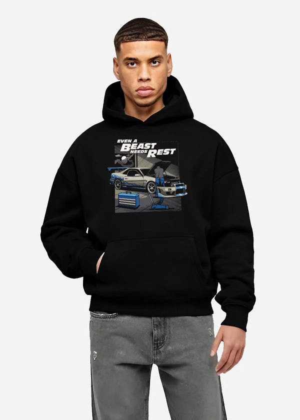 Black hoodie worn by a male model, front view, featuring racing tuner street retro beast performance motorsport automotive graphic.