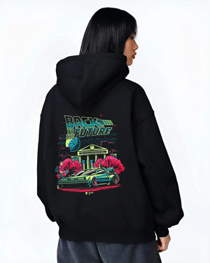 Black hoodie worn by a female model, back view, featuring DeLorean DMC-12 street retro classic racing performance graphic.