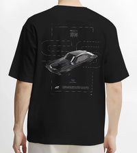 Black T-shirt worn by a male model, back view, featuring Chevrolet C10 retro classic enthusiast racing street performance graphic.