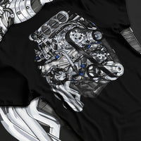 Black T-shirt laid flat with natural fabric folds, featuring turbo tuner street vintage enthusiast racing performance graphic.