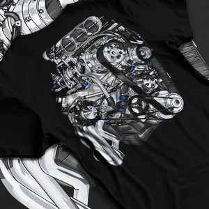 Black T-shirt laid flat with natural fabric folds, featuring turbo tuner street vintage enthusiast racing performance graphic.