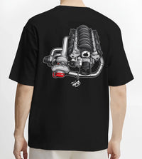 Black T-shirt worn by a male model, back view, featuring supercharged v8 muscle street retro power enthusiast racing graphic.