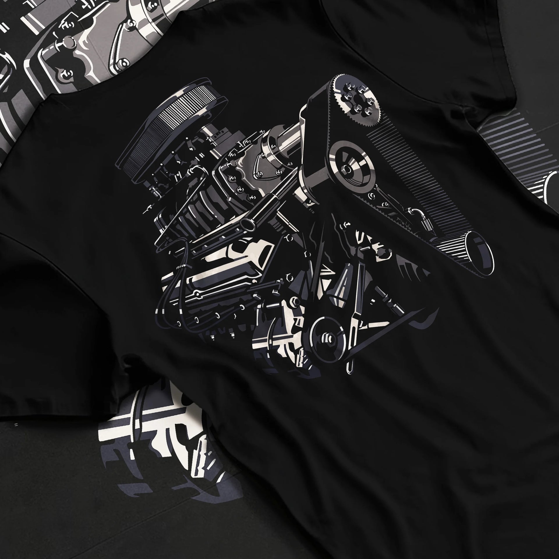Black T-shirt laid flat with natural fabric folds, featuring street enthusiast racing performance motorsport automotive graphic.