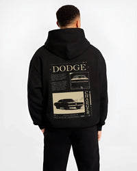 Black hoodie worn by a male model, back view, featuring Dodge Charger muscle street retro vintage enthusiast racing graphic.