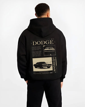 Black hoodie worn by a male model, back view, featuring Dodge Charger muscle street retro vintage enthusiast racing graphic.