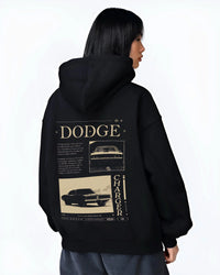 Black hoodie worn by a female model, back view, featuring Dodge Charger muscle street retro vintage enthusiast racing graphic.