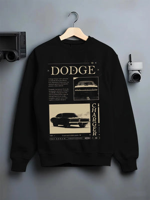 Black crewneck sweatshirt on a hanger against a grey wall, featuring Dodge Charger muscle street retro vintage enthusiast graphic.