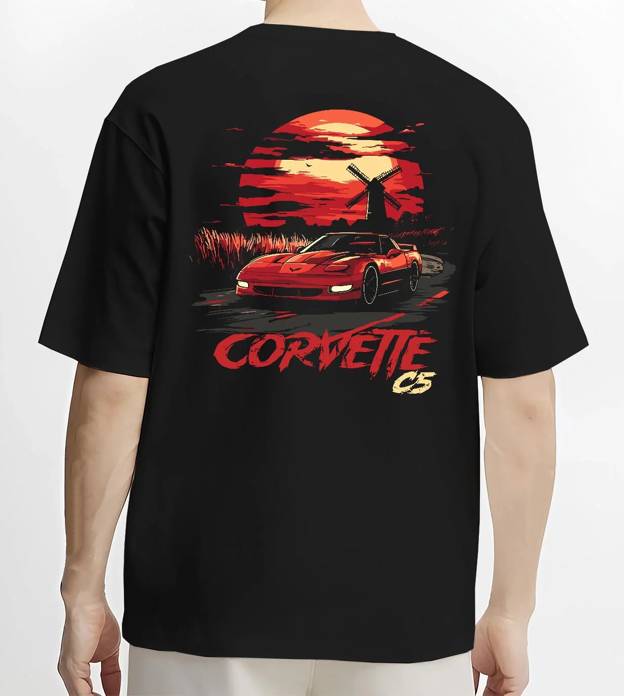 Black T-shirt worn by a male model, back view, featuring Chevrolet Camaro racing drag american muscle street retro vintage graphic.