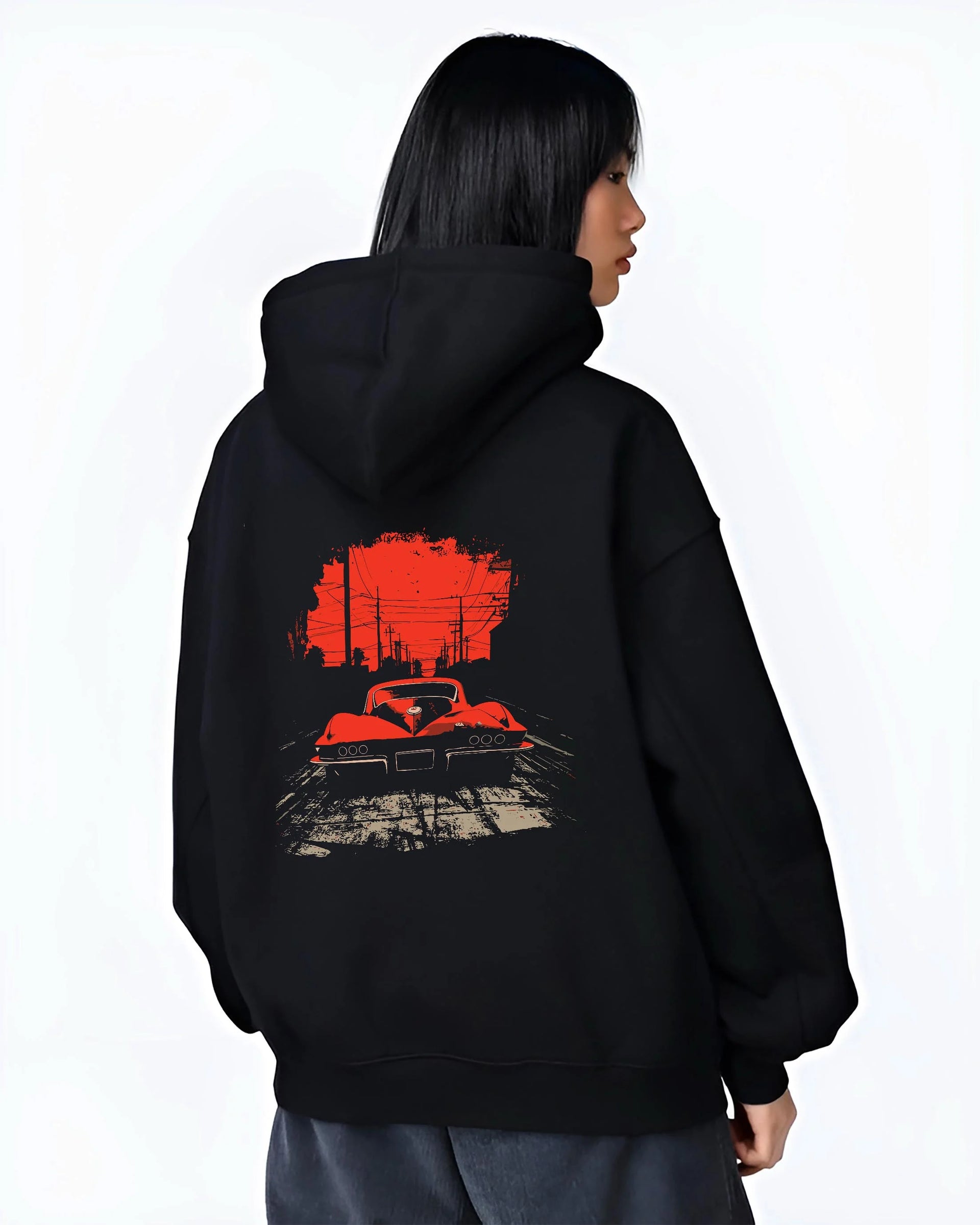 Black hoodie worn by a female model, back view, featuring Chevrolet Corvette muscle retro classic enthusiast racing street graphic.