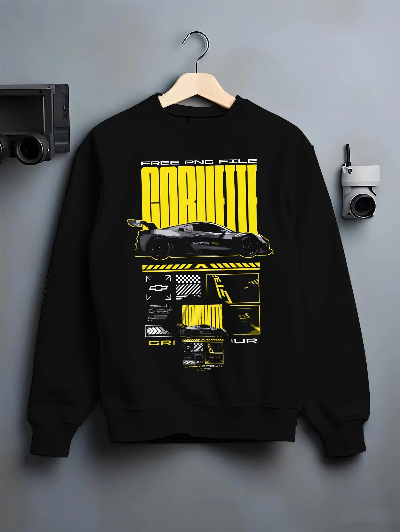 Black crewneck sweatshirt on a hanger against a grey wall, featuring Chevrolet Corvette gt3 rs racing motorsport street graphic.