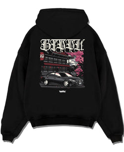 Black pullover hoodie laid flat on a white background, featuring Toyota rs race drift jdm japanese street racing graphic.