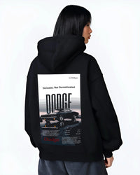 Black hoodie worn by a female model, back view, featuring Dodge Challenger american muscle street retro classic legend graphic.