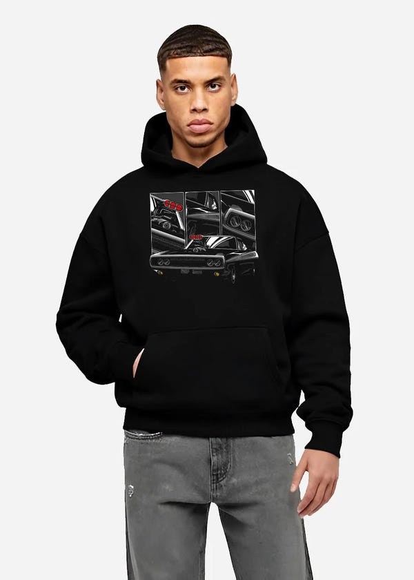 Black hoodie worn by a male model, front view, featuring Dodge Charger supercharged american muscle classic enthusiast graphic.