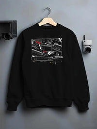 Black crewneck sweatshirt on a hanger against a grey wall, featuring Dodge Charger supercharged american muscle classic graphic.
