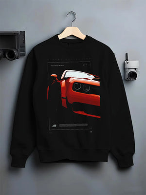 Black crewneck sweatshirt on a hanger against a grey wall, featuring Dodge Challenger srt racing muscle street enthusiast graphic.