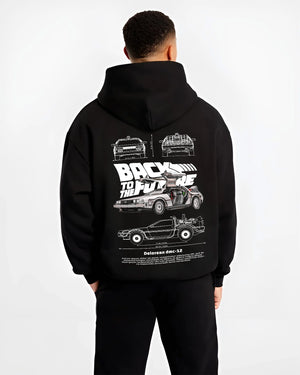 Black hoodie worn by a male model, back view, featuring DeLorean DMC-12 street retro racing performance motorsport dmcbtf.