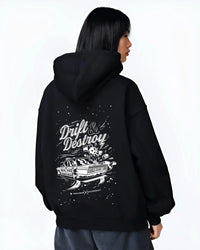 Black hoodie worn by a female model, back view, featuring racing drift street retro performance motorsport automotive graphic.